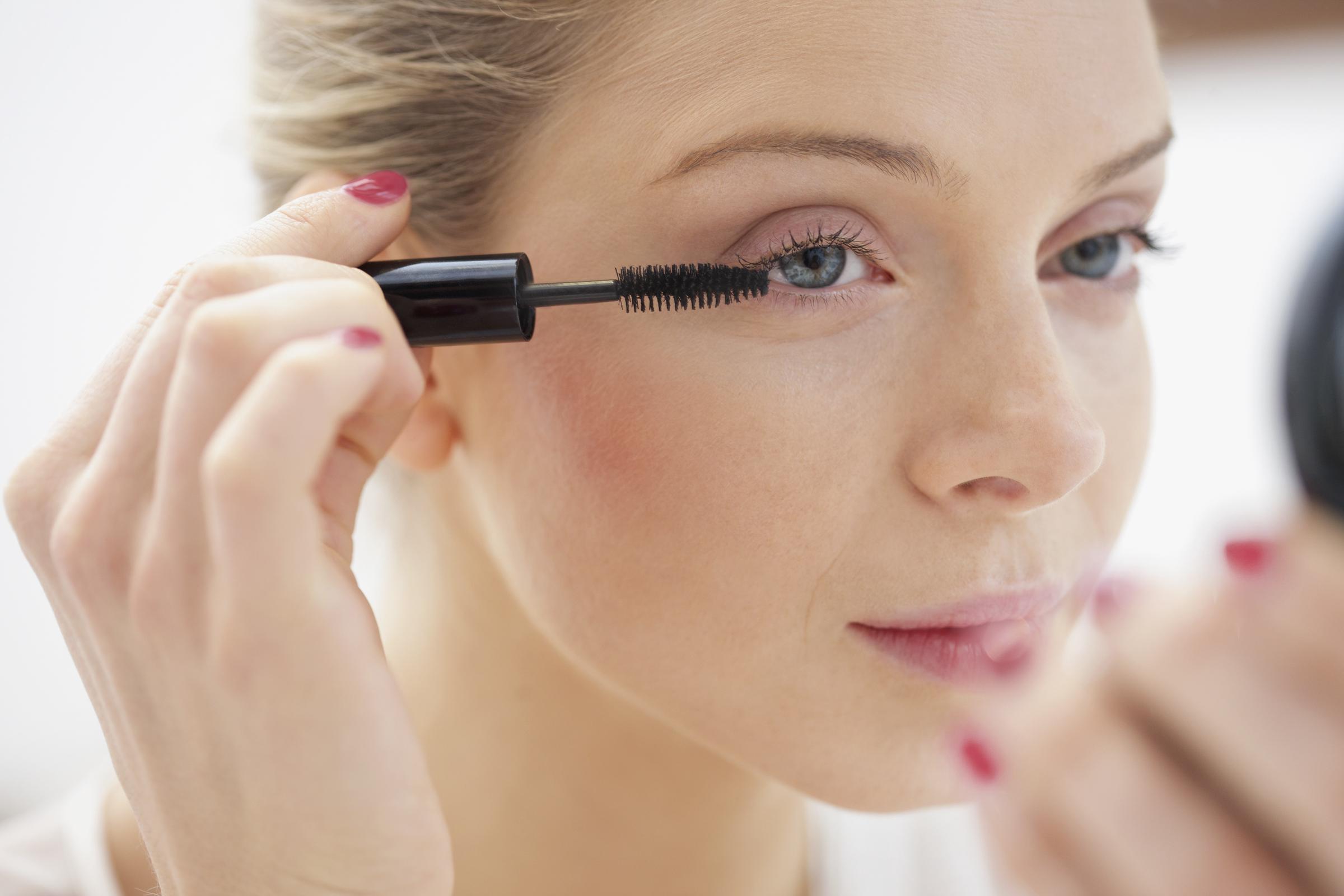 A woman applying mascara | Source: Getty Images