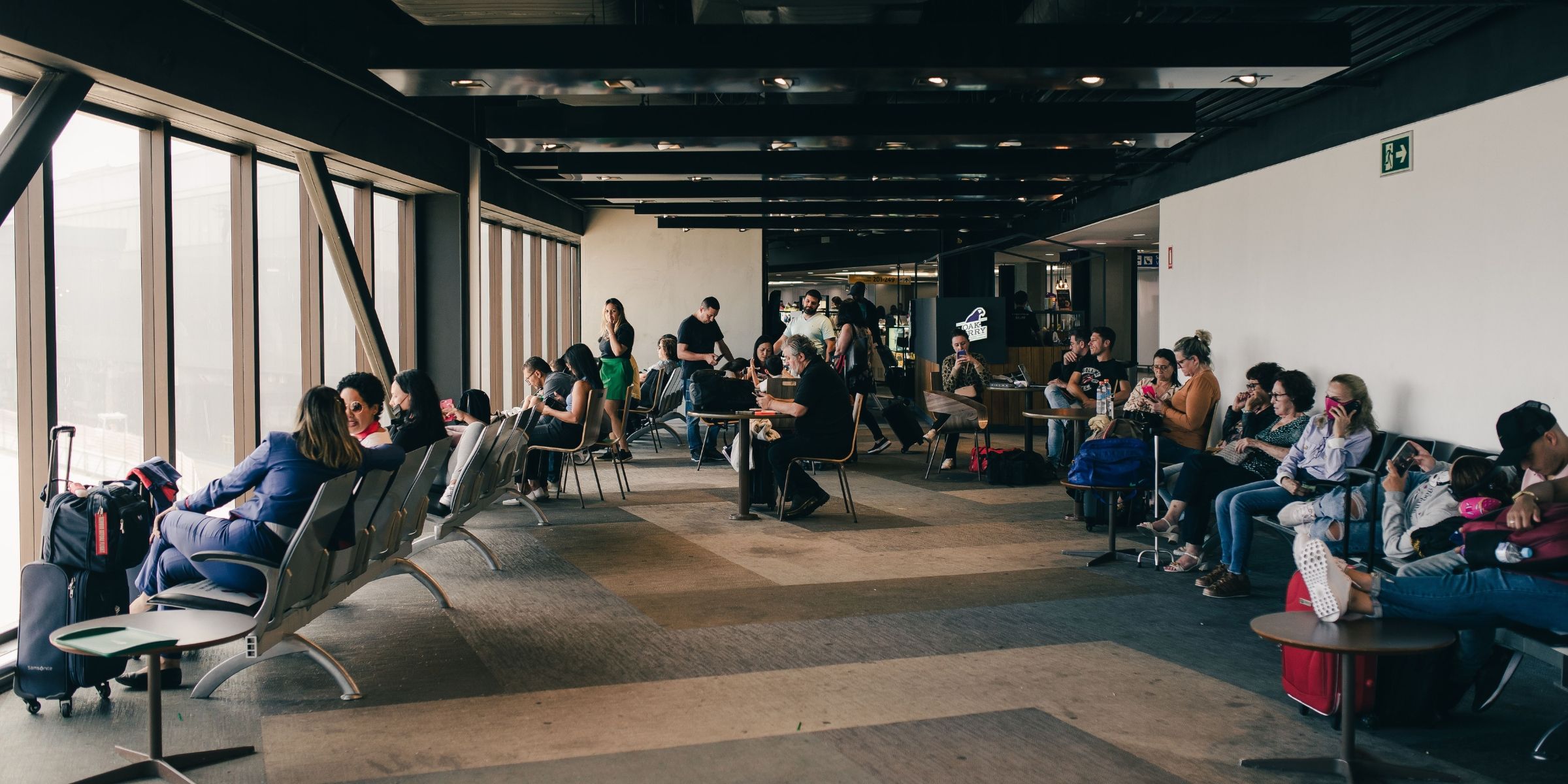 People seated at an airport's boarding area | Source: Pexels