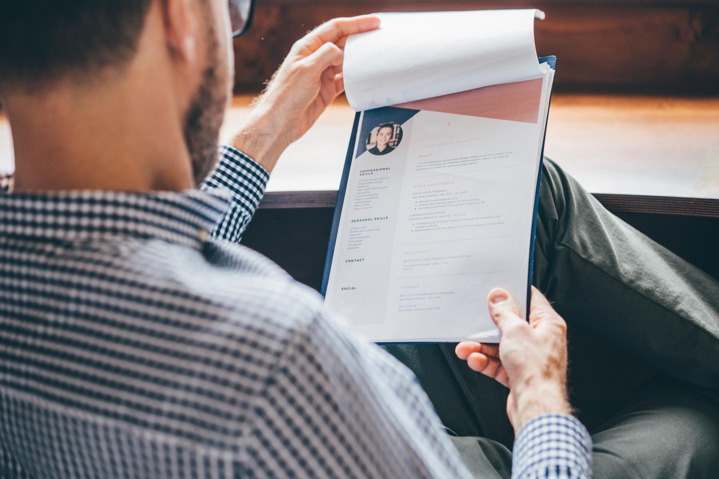 A recruiter looking at a resume | Source: Getty Images