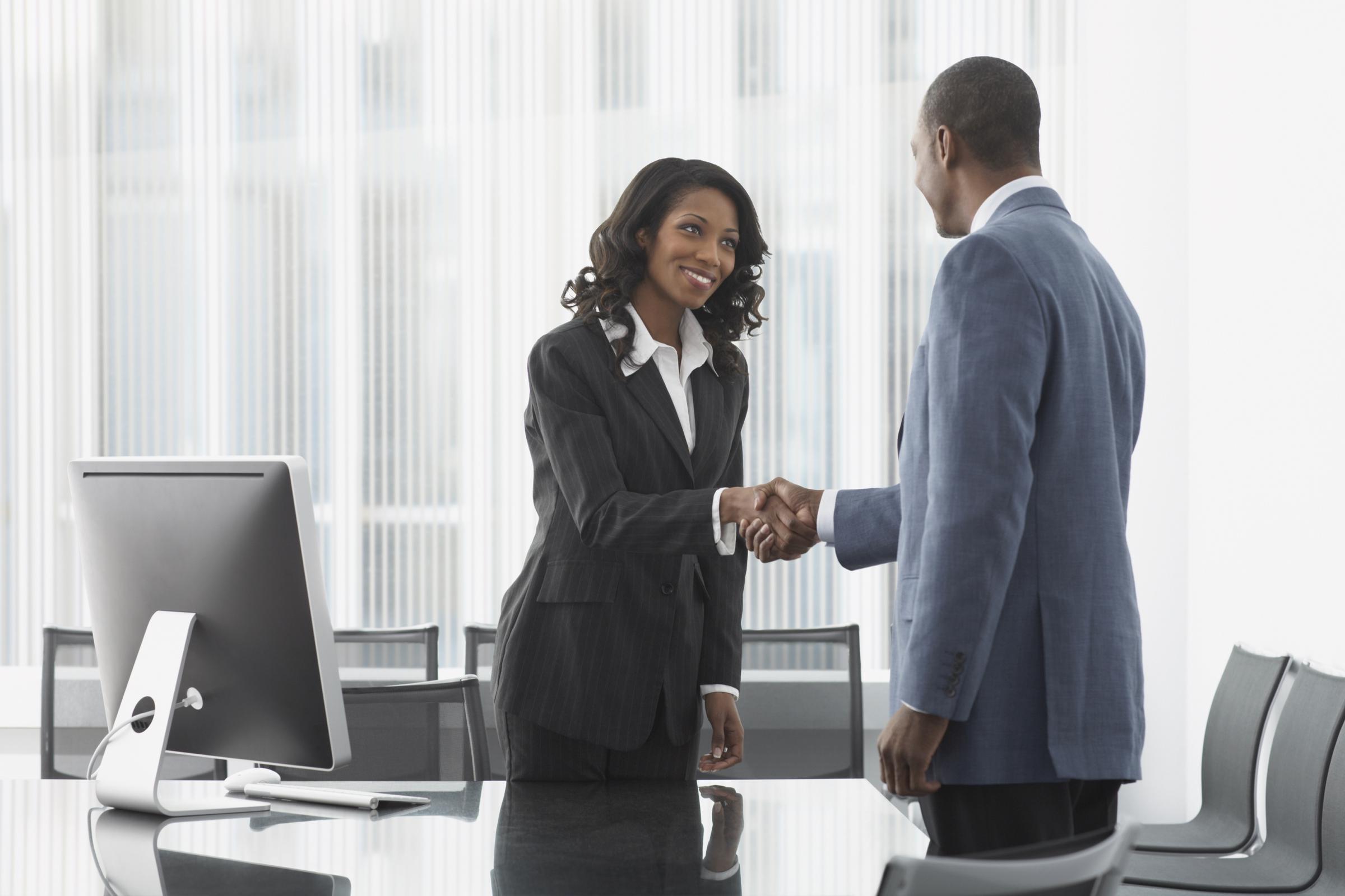 A recruiter shaking hands with a job candidate | Source: Getty Images