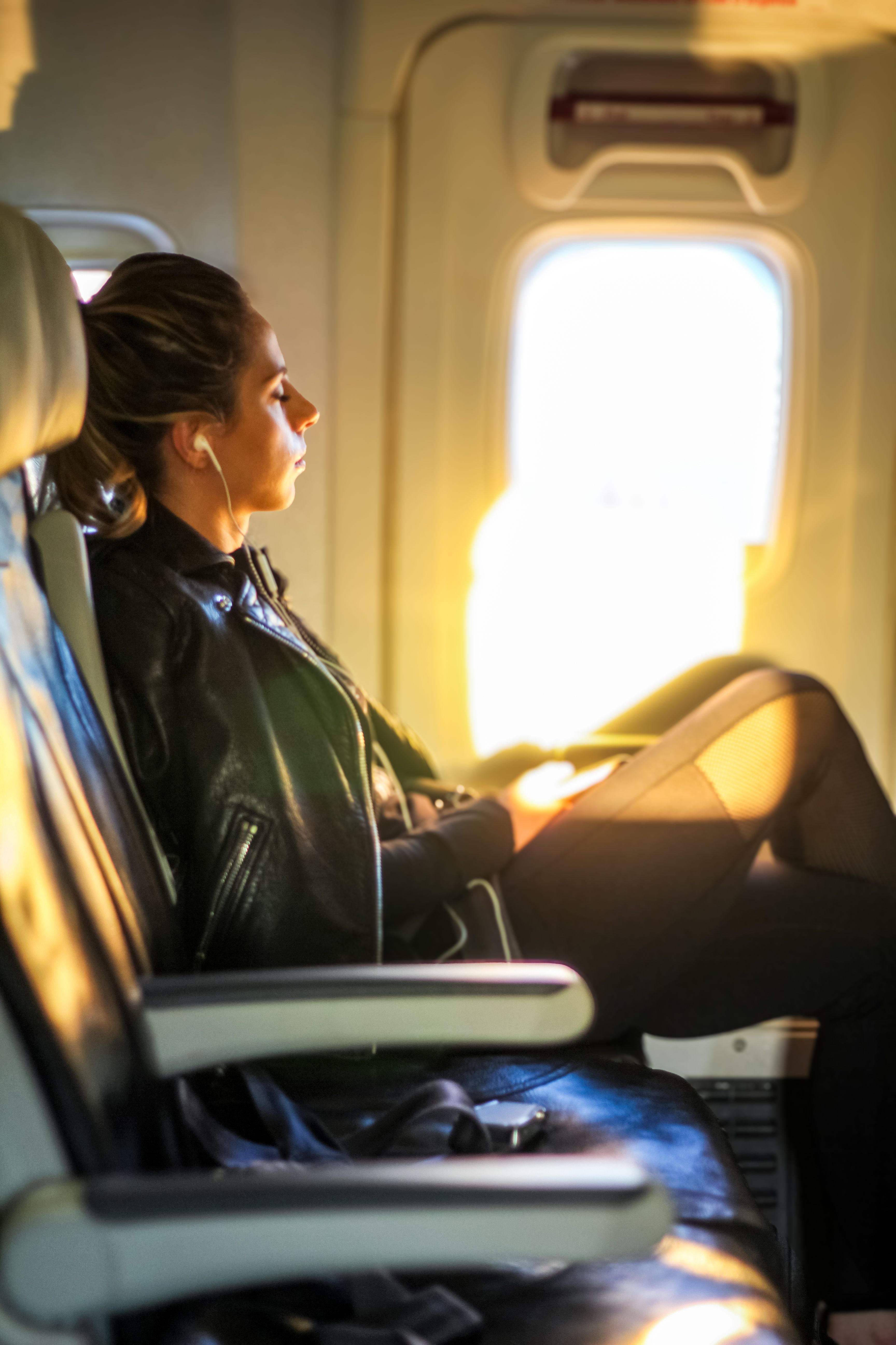 A passenger seated in economy during a flight | Source: Pexels