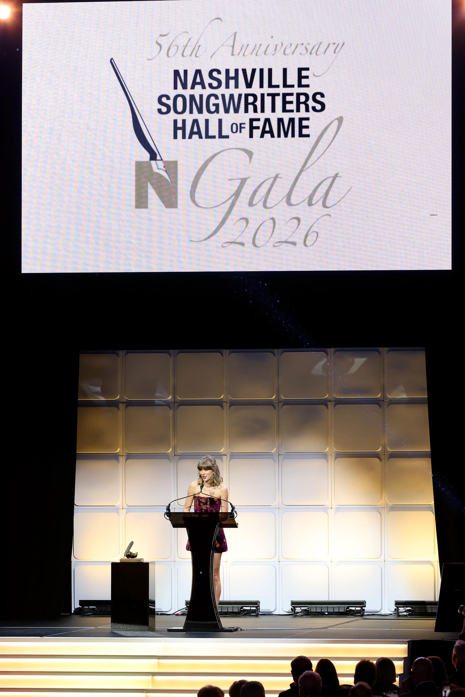 Taylor Swift takes the stage at the 56th Nashville Songwriters Hall of Fame Gala, where she became the youngest-ever inductee at age 36. | Source: Getty Images