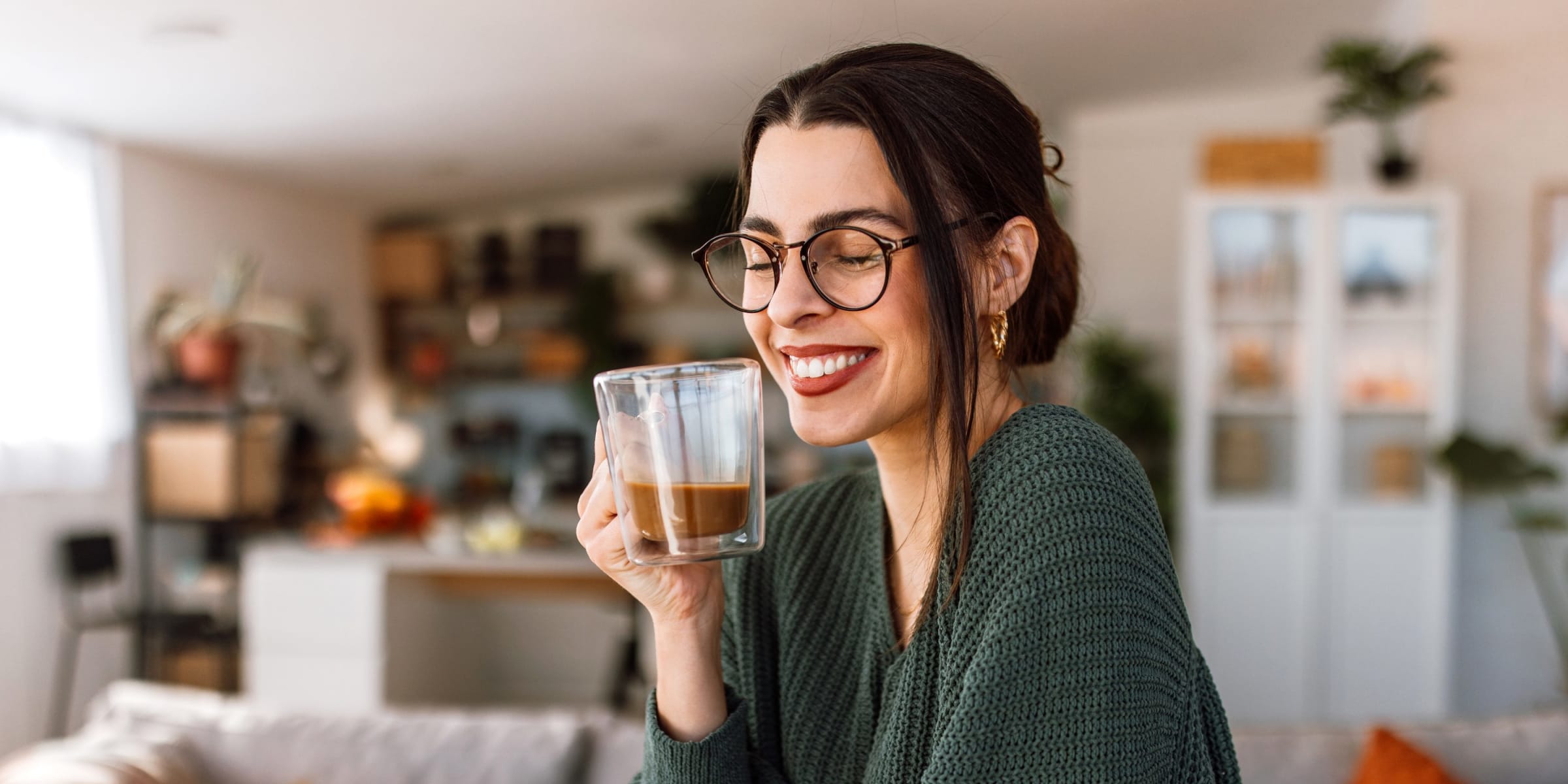 A woman enjoying a cup of coffee | Source: Getty Images