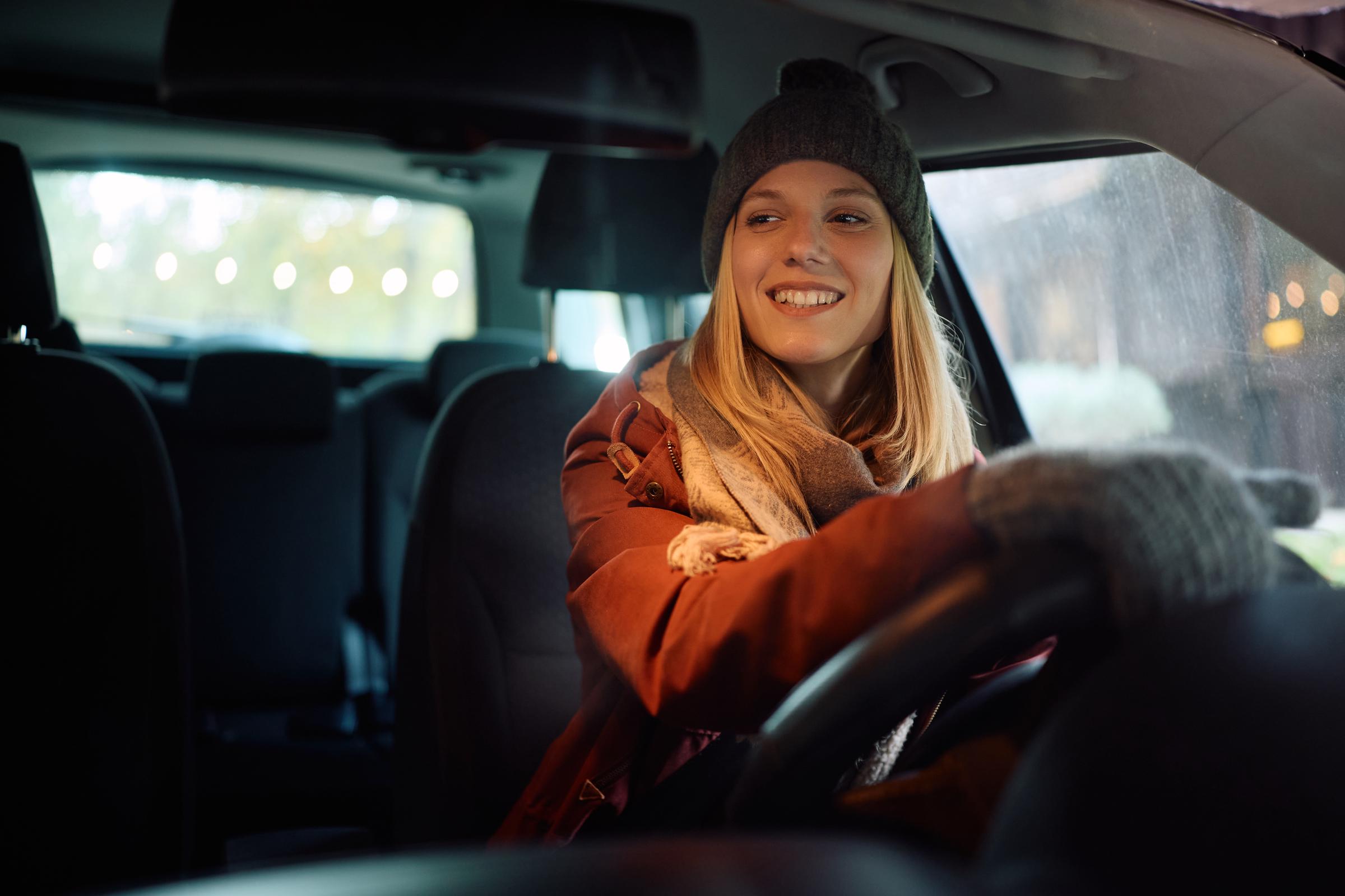 A young woman driving in winter | Source: Getty Images