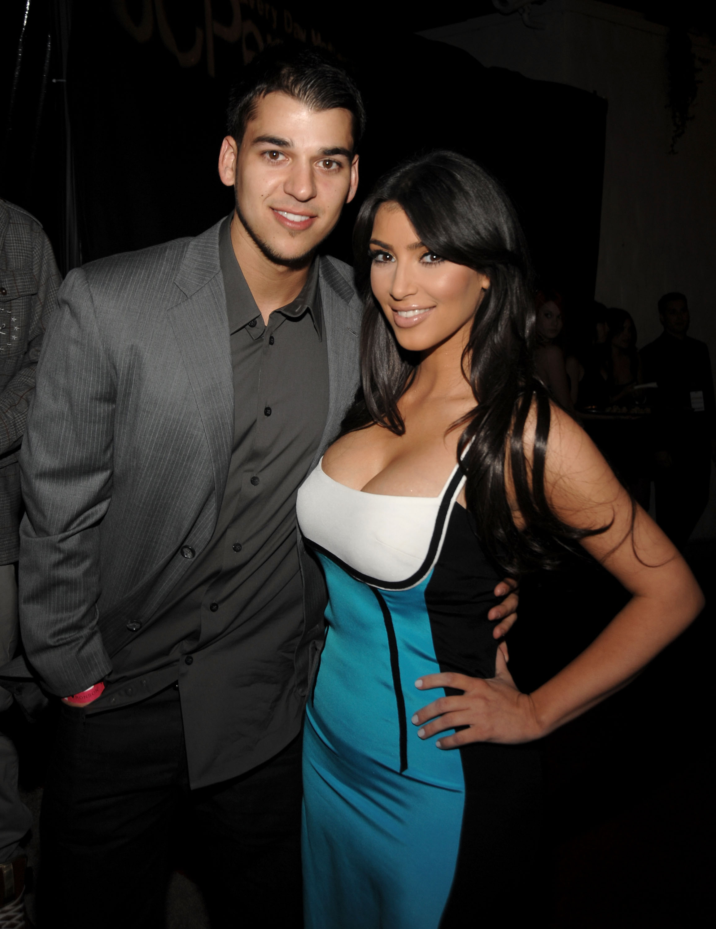 Rob Kardashian poses with his sister Kim Kardashian at a public event in their early years of fame. The photo captures a time when the siblings regularly appeared together, long before Rob began stepping away from the spotlight. | Source: Getty Images.