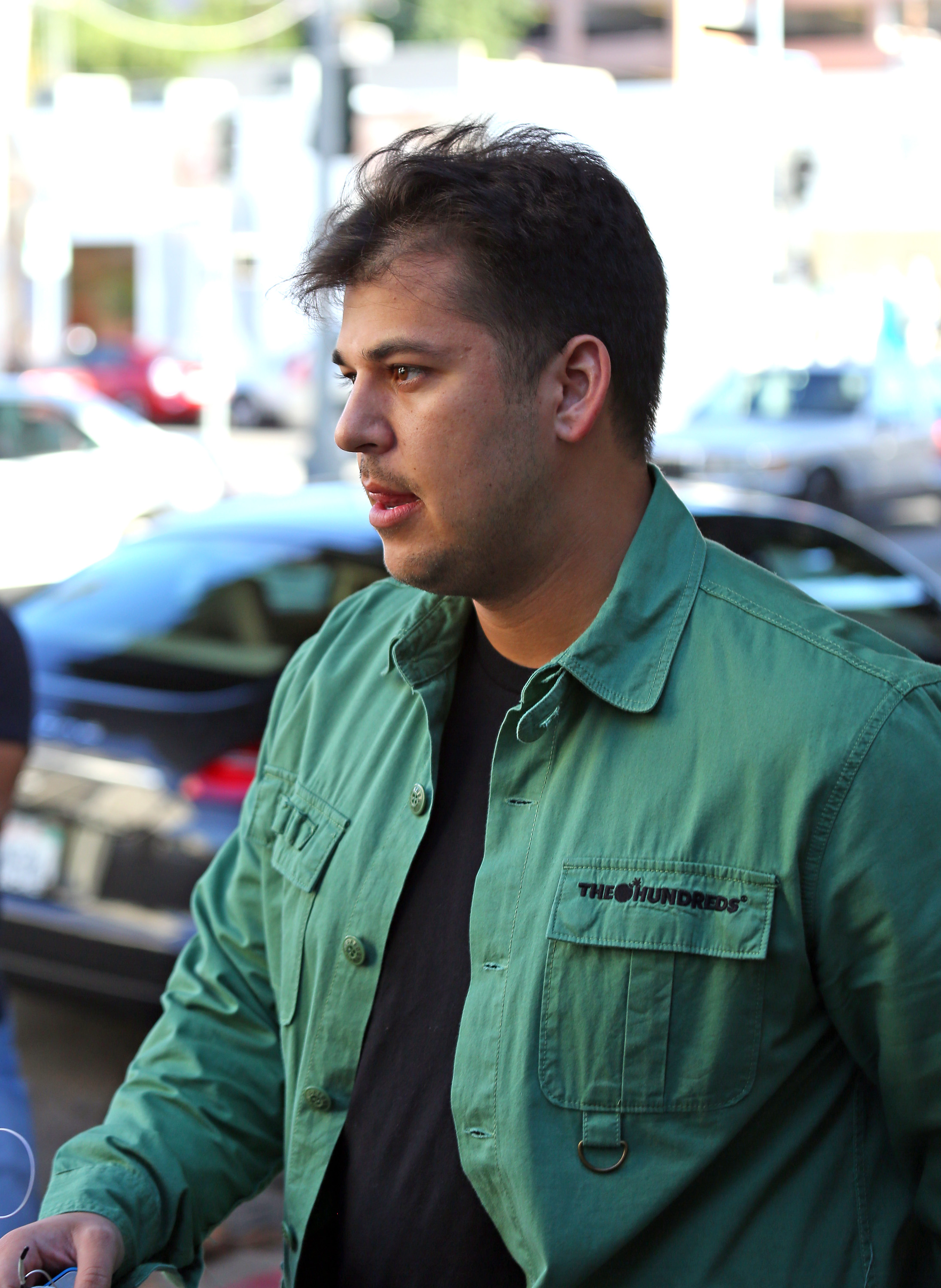 Rob Kardashian is pictured in a green jacket during a public outing in 2013, as his changing appearance was becoming a topic of media attention. Around this time, he began speaking openly about his struggles with weight and confidence. | Source: Getty Images.
