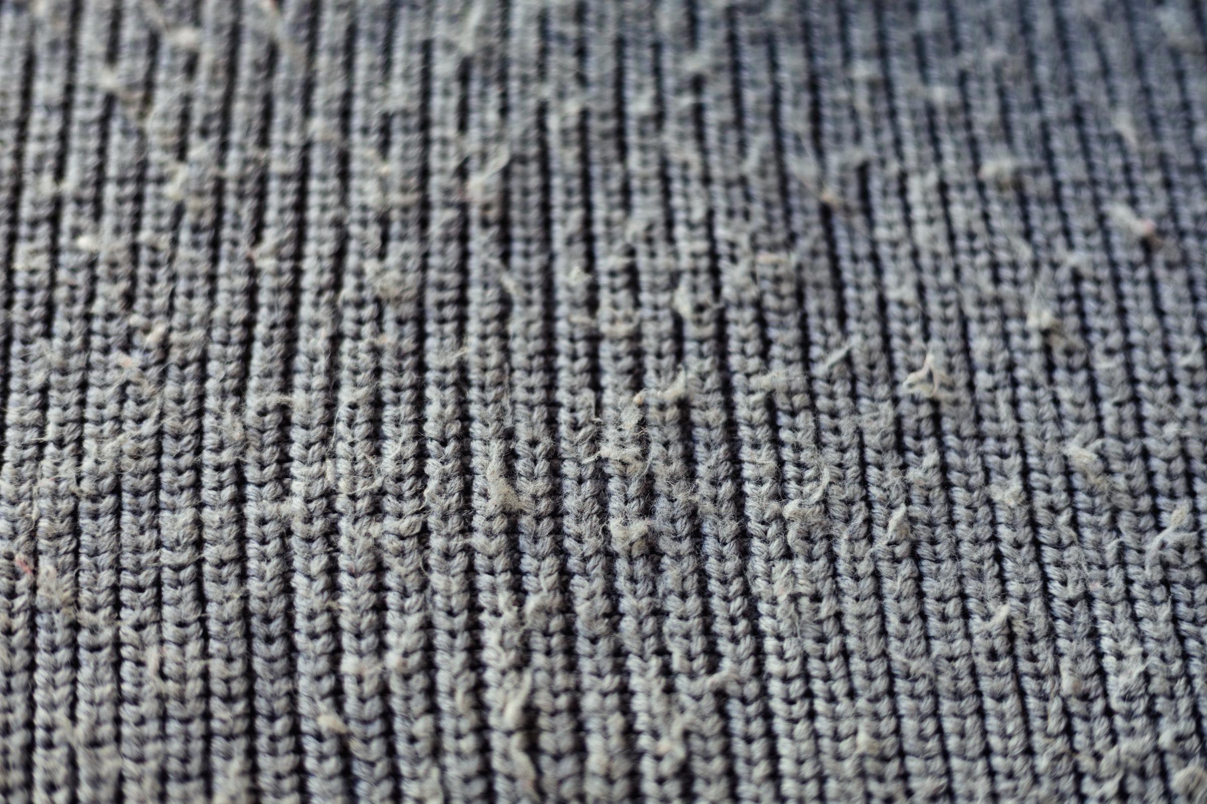 Close up of a sweater with pills | Source: Getty Images