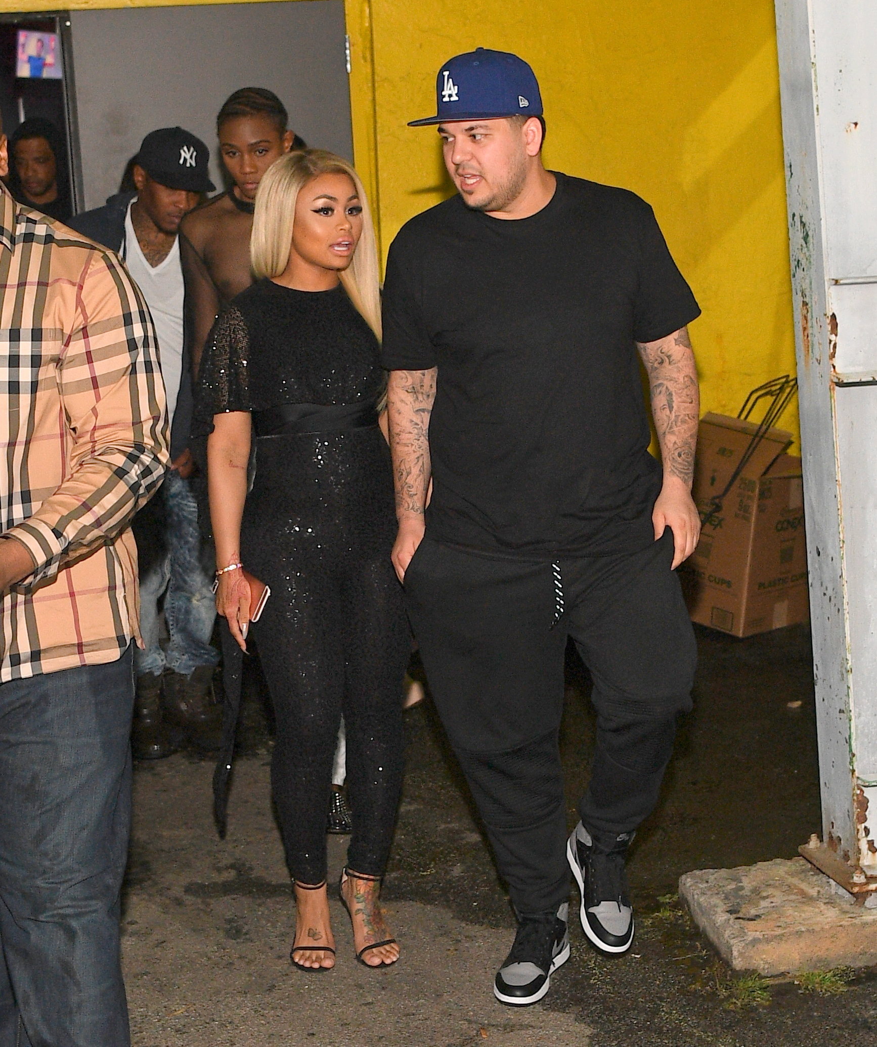 Rob Kardashian is photographed leaving a venue alongside his then-fiancée Blac Chyna in 2016. Their relationship marked a period of renewed public appearances for Rob, who had previously spoken about his struggles with body confidence. | Source: Getty Images.