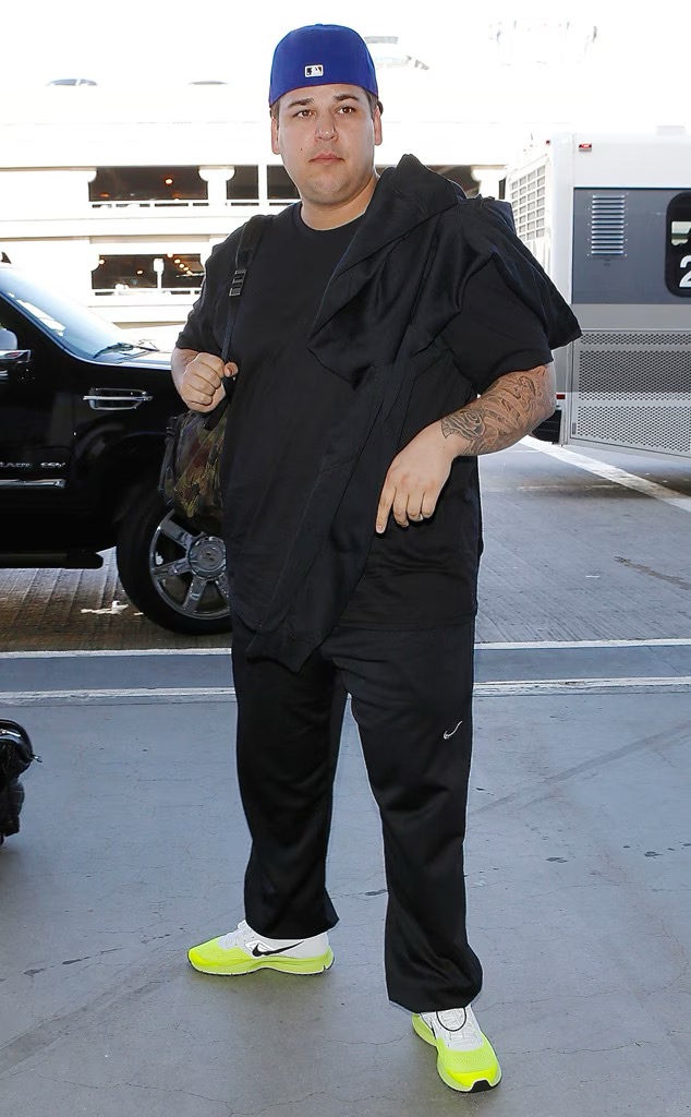 Rob Kardashian is pictured in a green jacket during a public outing in 2013. The photograph captures an early stage of his changing appearance, before he began withdrawing from family celebrations and public events. | Source: Getty Images.