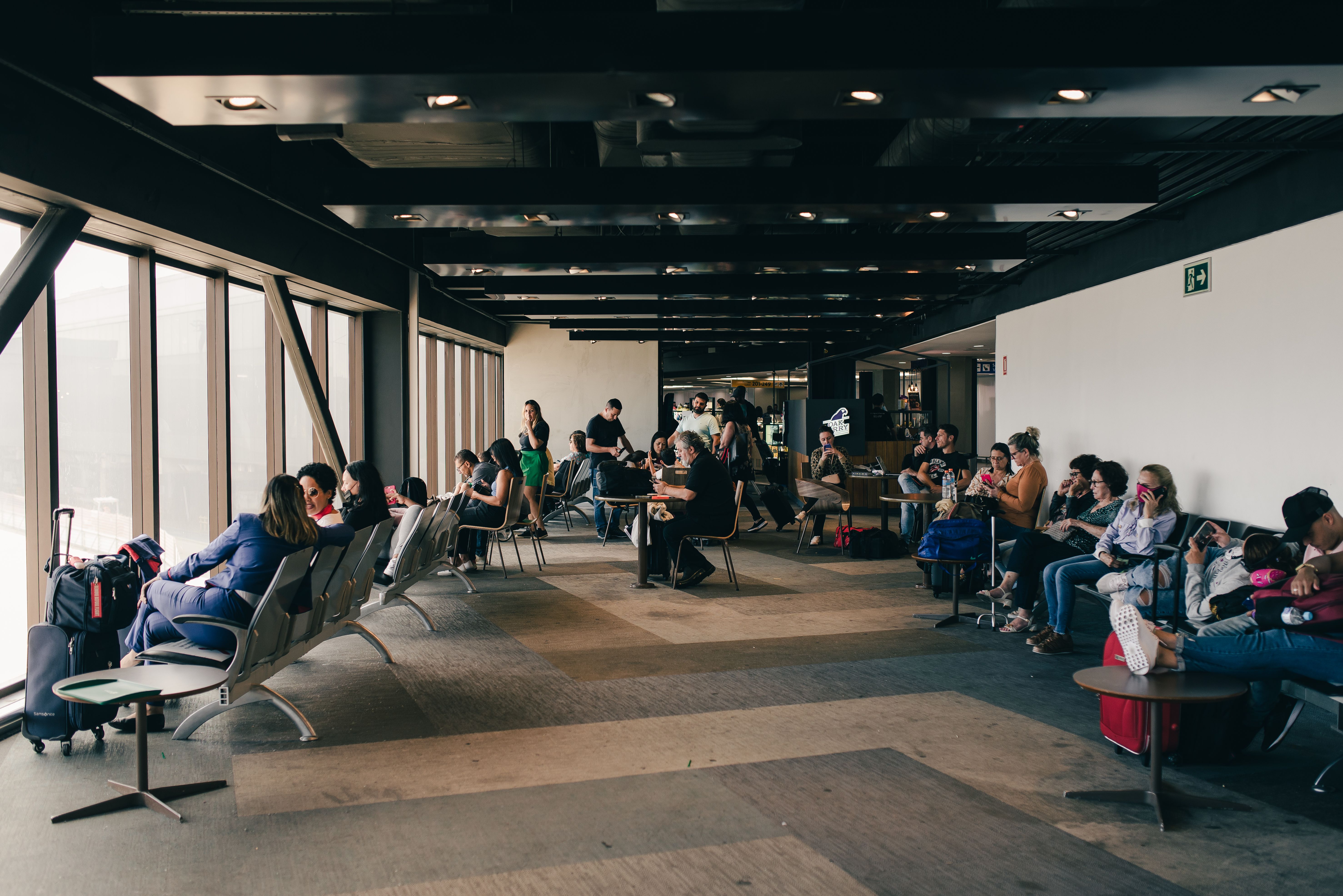 People waiting at an airport gate | Source: Pexels