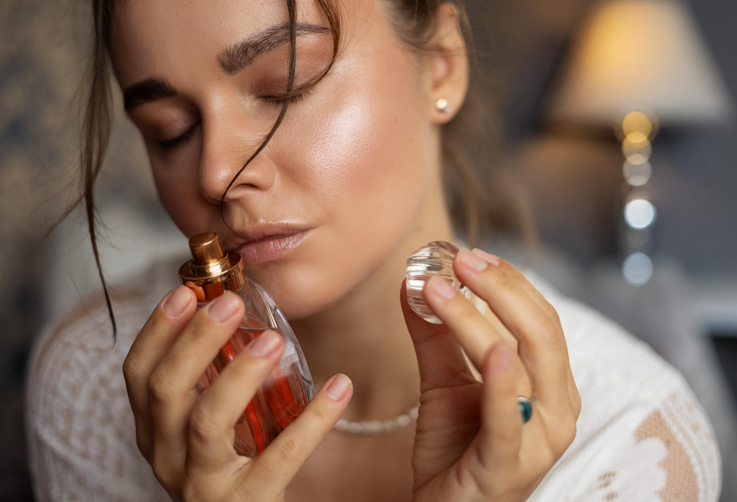 A woman smelling perfume | Source: Getty Images