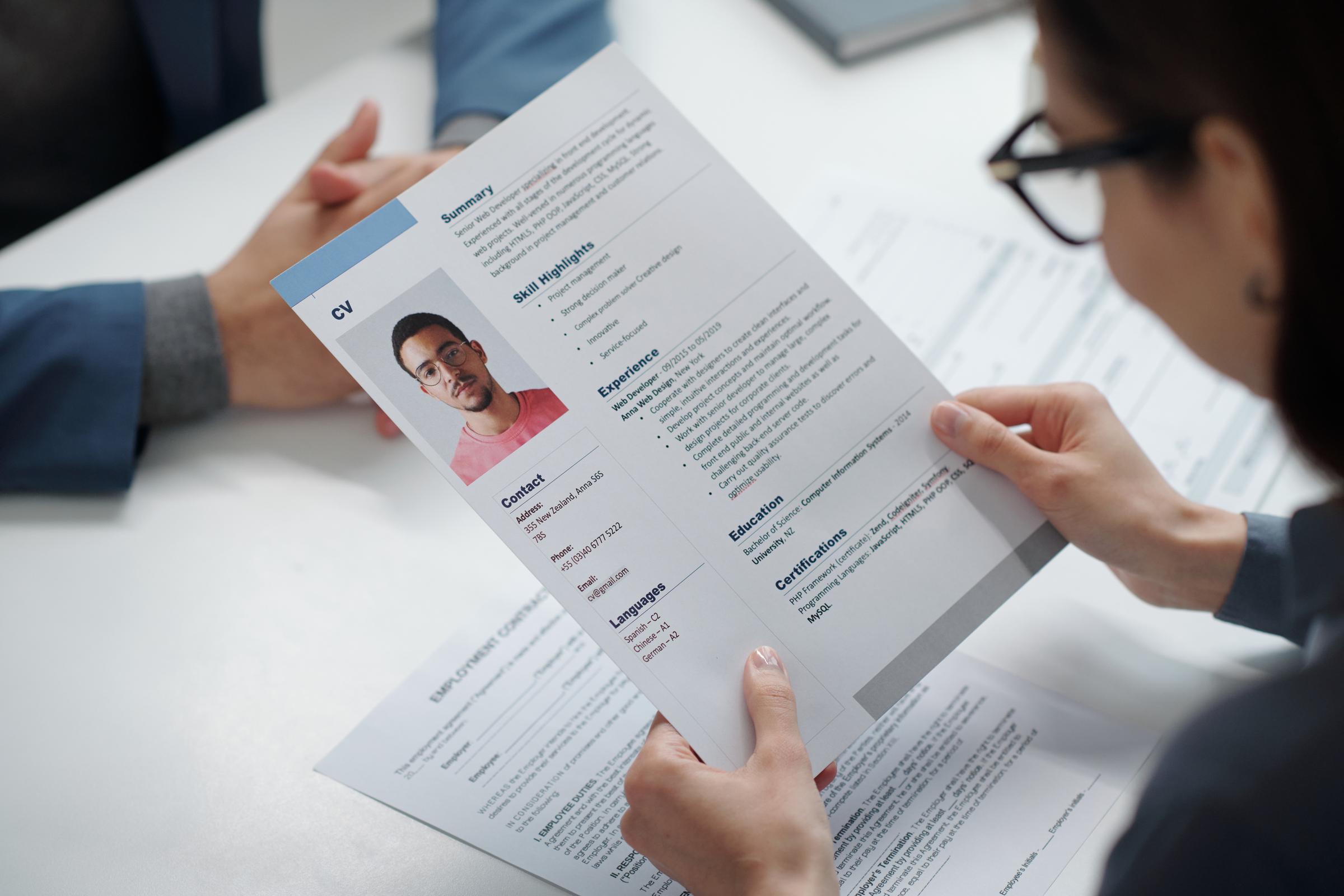 A recruiter looking at a resume | Source: Getty Images
