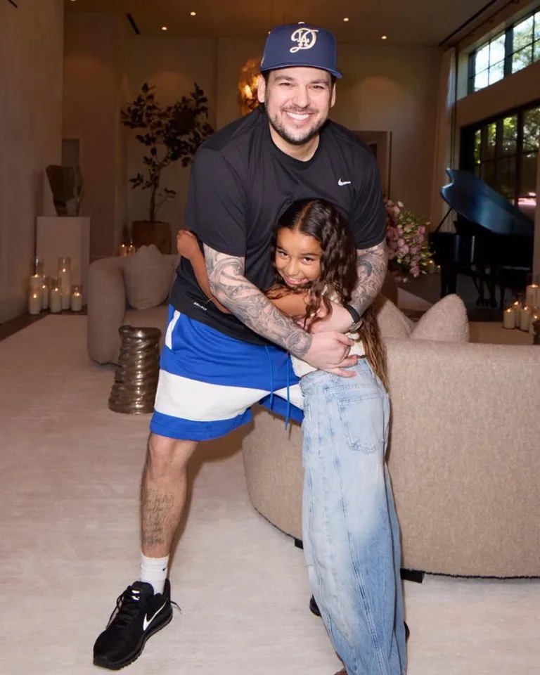 Rob Kardashian shares a sweet father-daughter moment with Dream, wrapping his arms around her as they smile together at home. The photo offers a rare glimpse of their close bond and the little girl he has called his biggest priority. | Source: Instagram/kimkardashian.