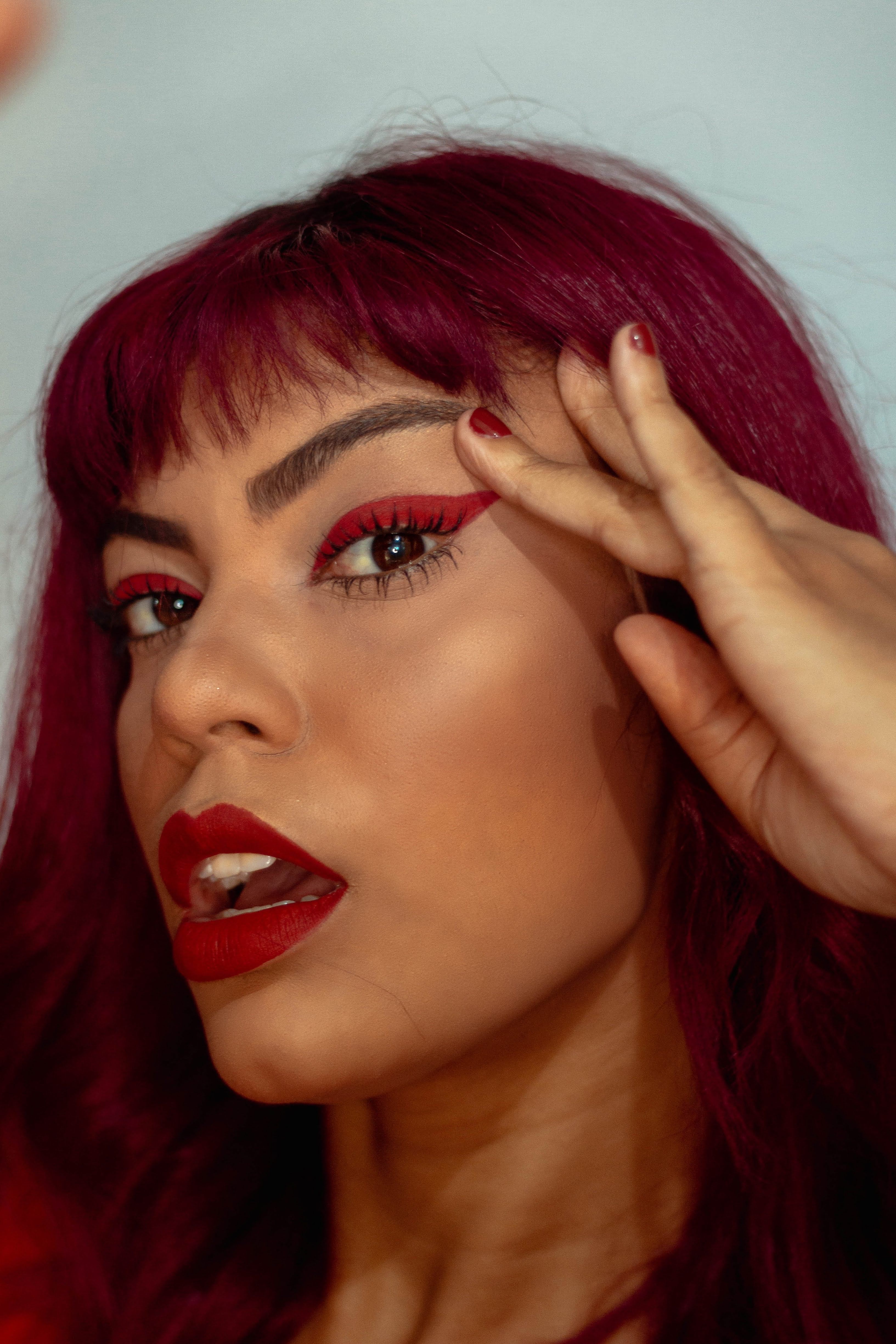 Woman wearing red eyeliner | Source: Pexels