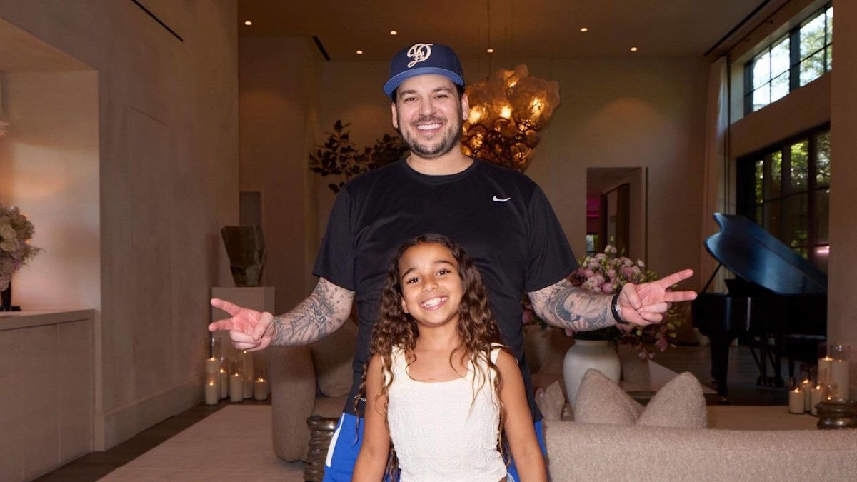 Rob Kardashian smiles alongside his daughter Dream in a family photo shared by Kim Kardashian on Instagram. The pair pose together with matching smiles, offering a sweet glimpse of Rob's life as a devoted father away from the spotlight. | Source: Instagram/kimkardashian.