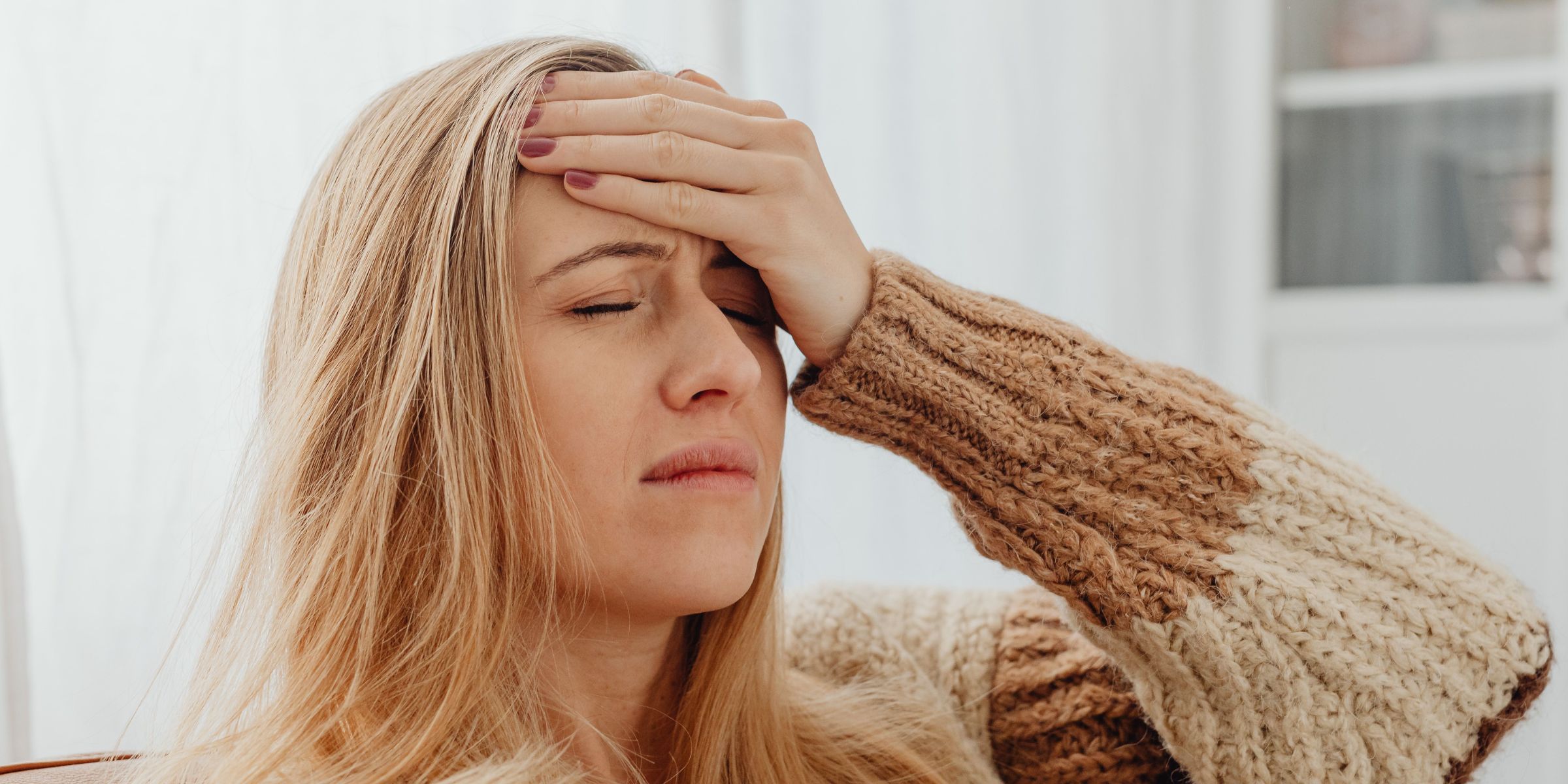 Woman suffering from a migraine | Source: Pexels