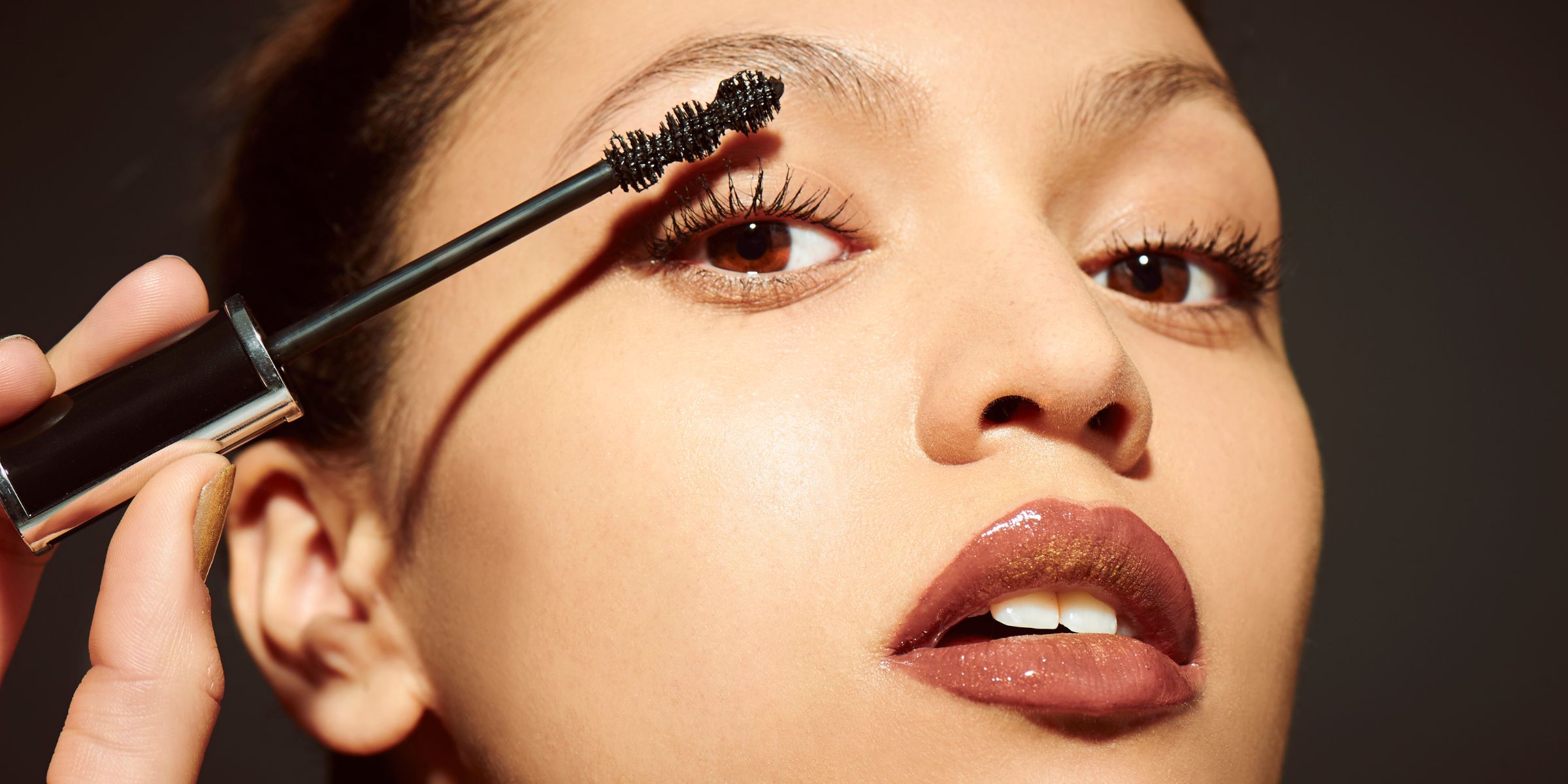 A woman applying mascara | Source: Getty Images